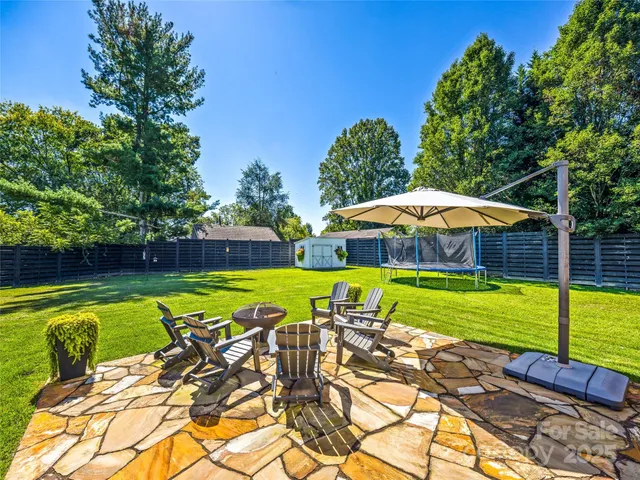 a view of swimming pool with seating area and furniture
