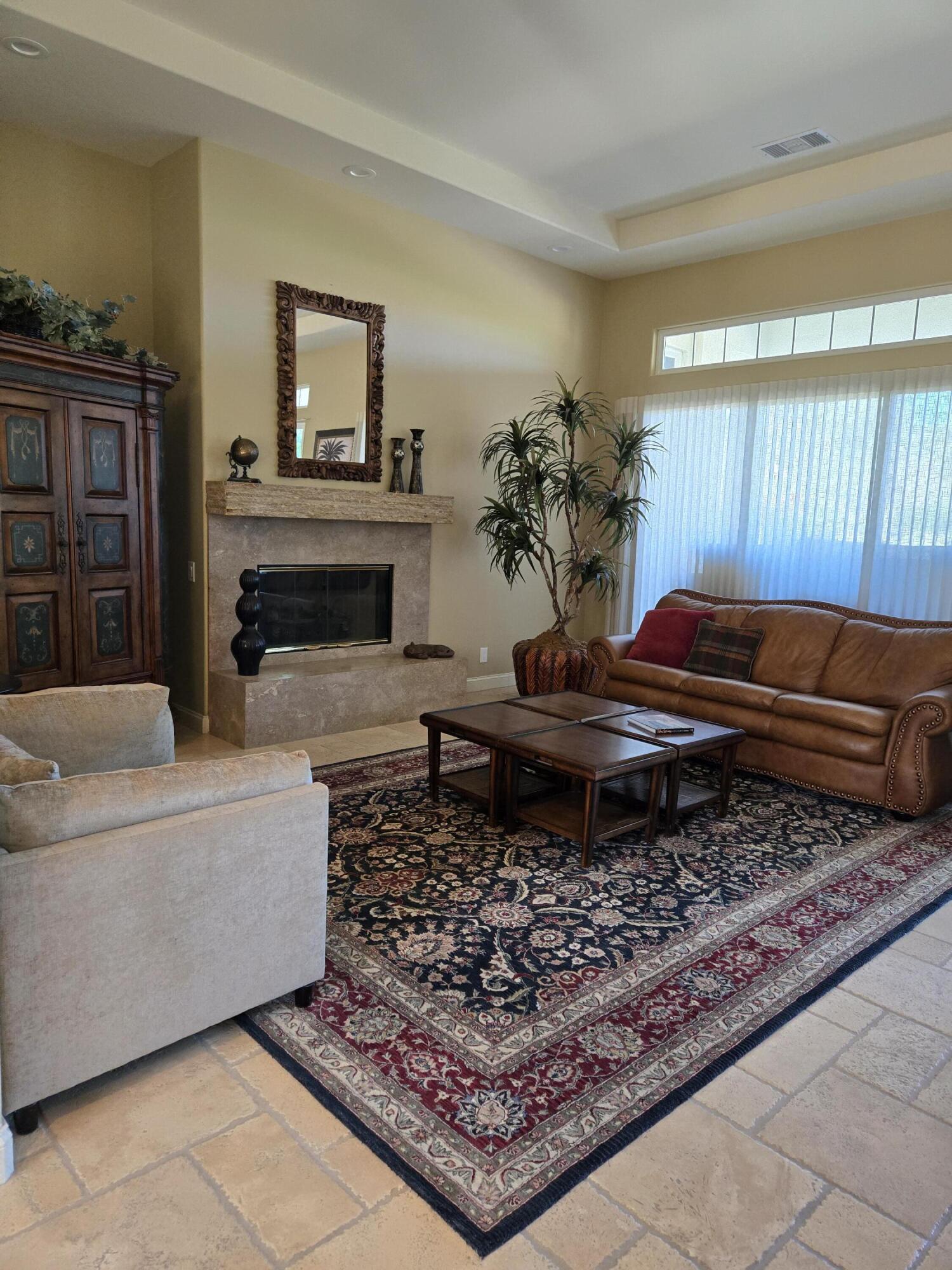 15 Vía Verde Rancho Mirage, CA 92270 - Photo 11 of 23 a living room with a couch and a fireplace