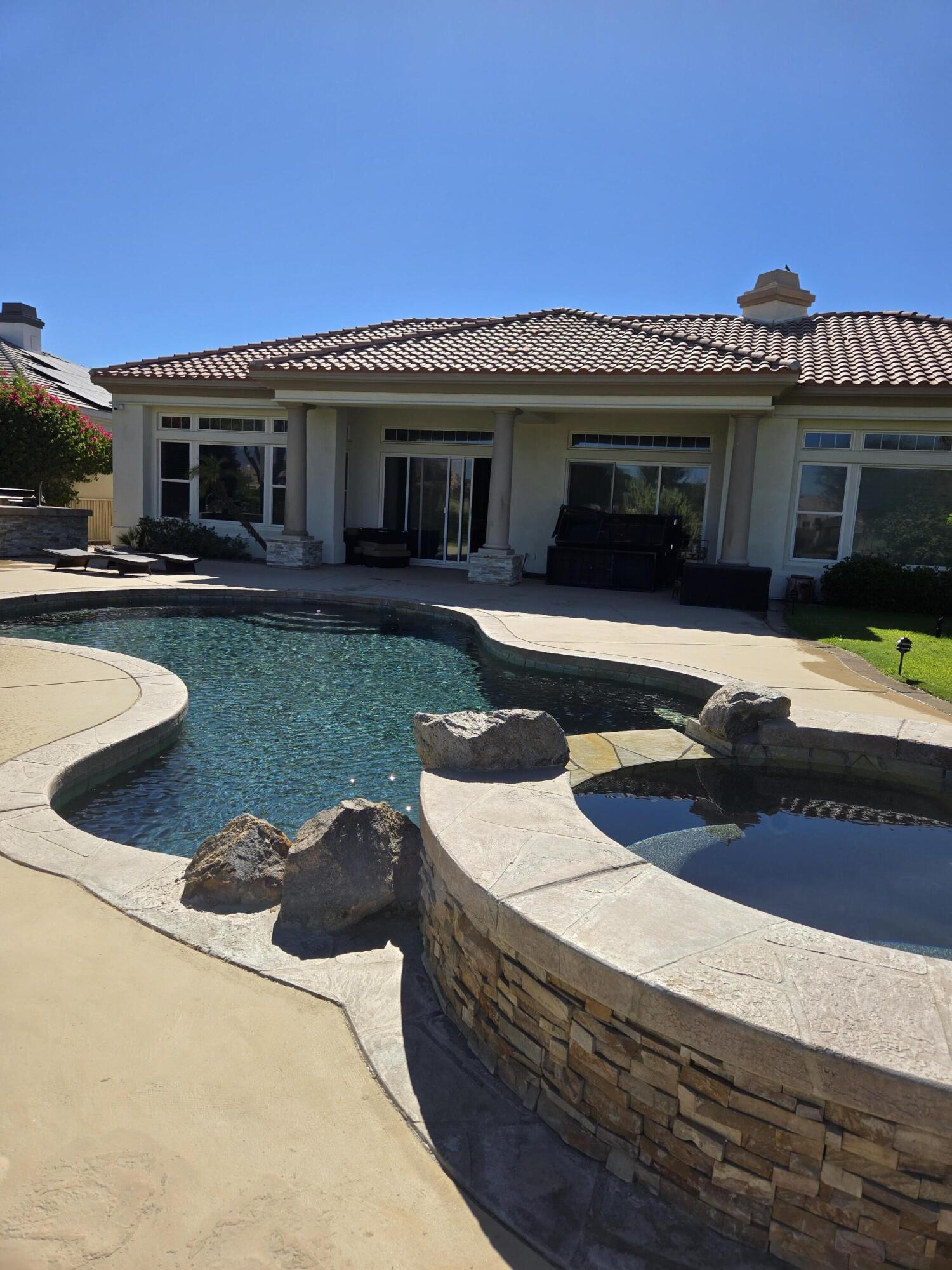 15 Vía Verde Rancho Mirage, CA 92270 - Photo 18 of 23 a front view of a house with swimming pool