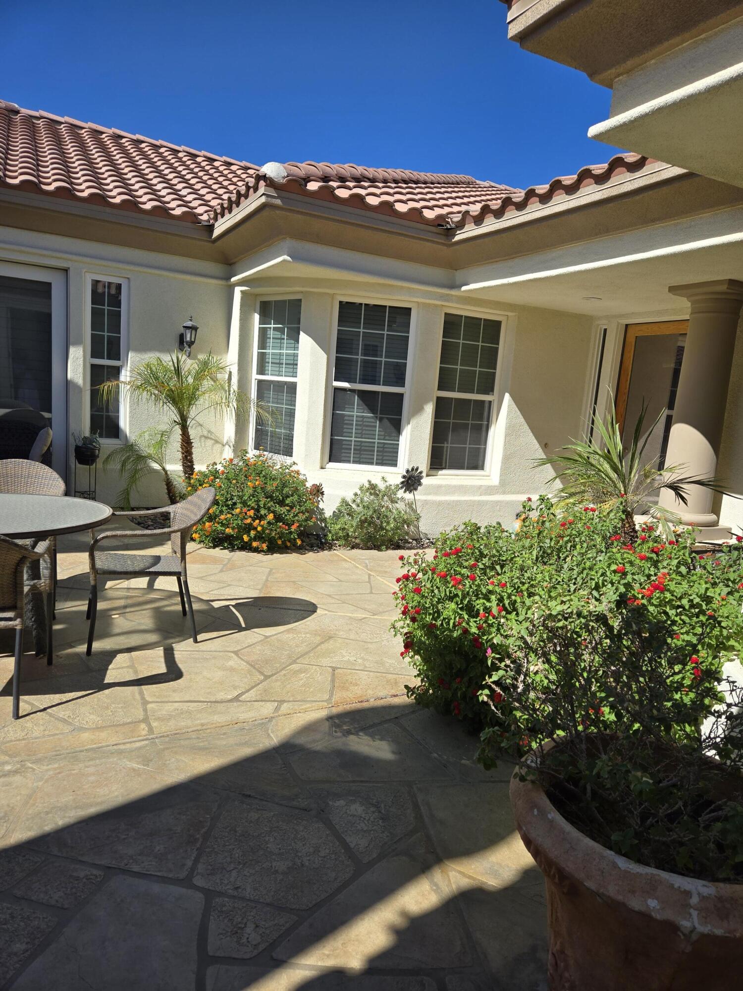 15 Vía Verde Rancho Mirage, CA 92270 - Photo 22 of 23 a front view of a house with garden