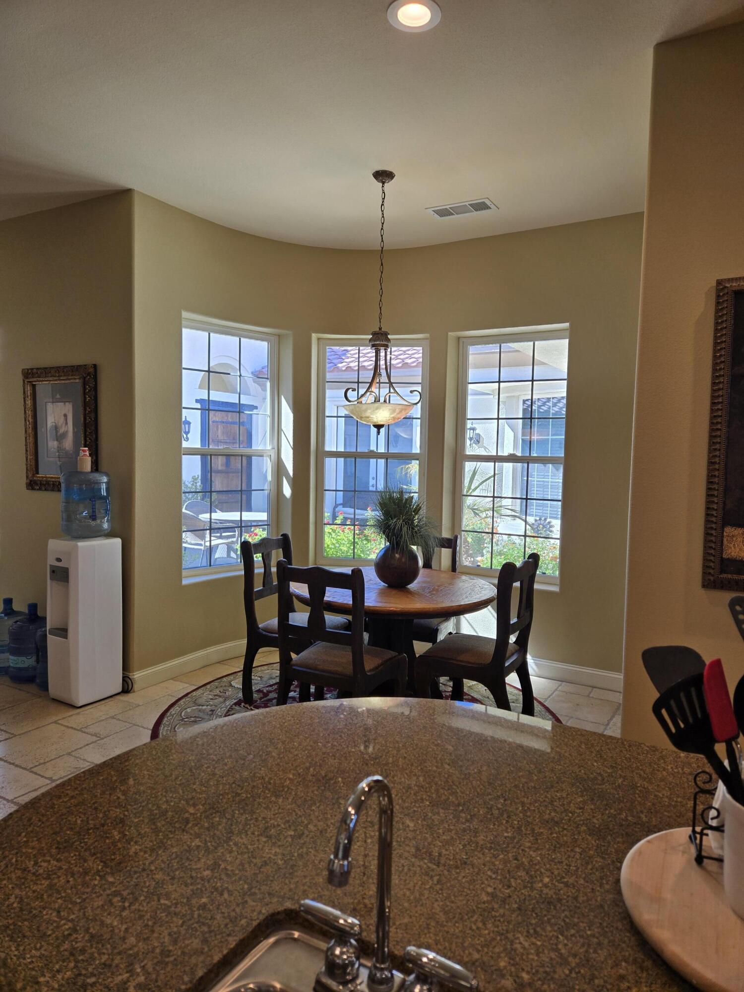 15 Vía Verde Rancho Mirage, CA 92270 - Photo 5 of 23 a living room with furniture windows and a flat screen tv