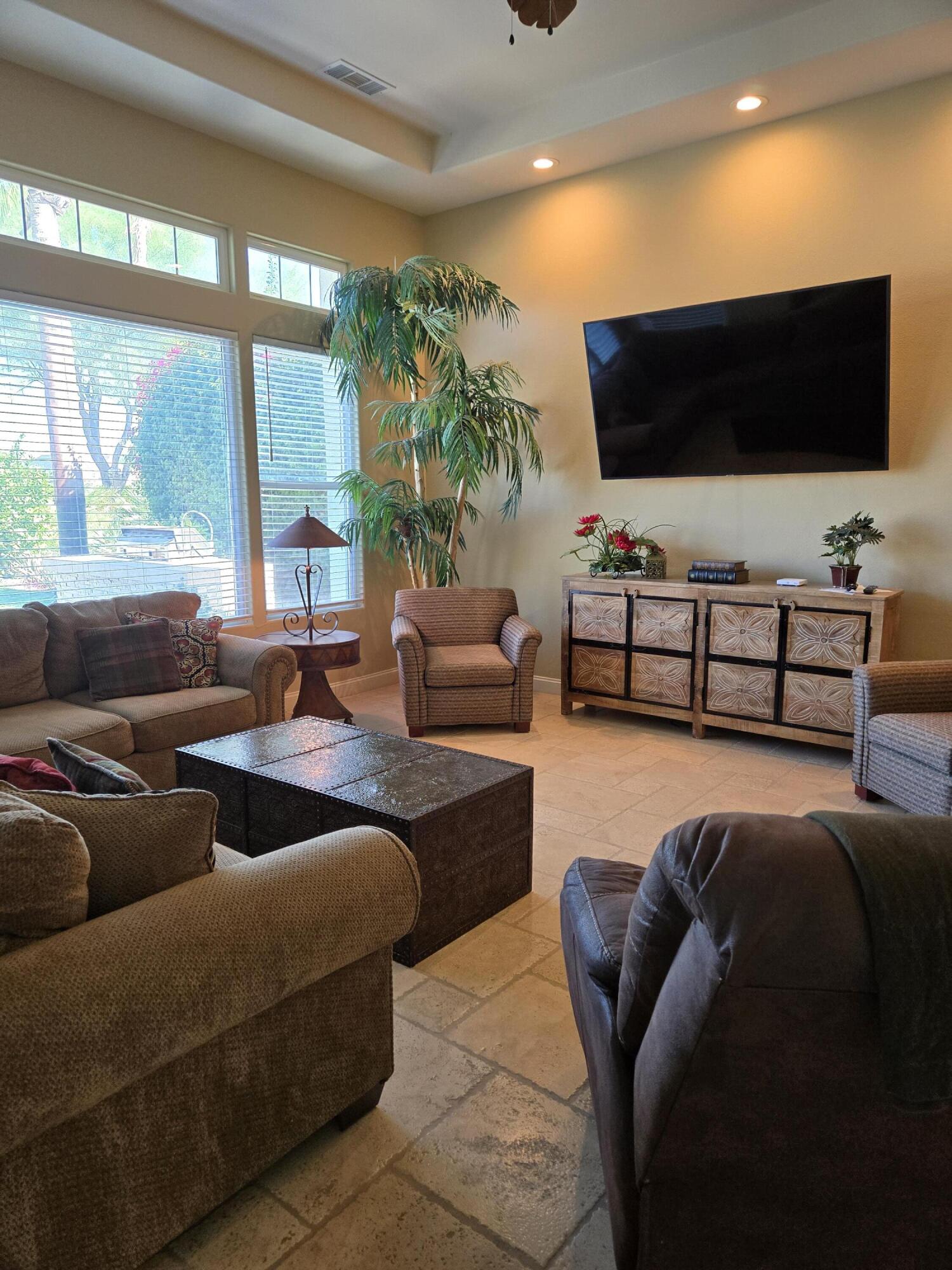 15 Vía Verde Rancho Mirage, CA 92270 - Photo 7 of 23 a living room with furniture and a flat screen tv