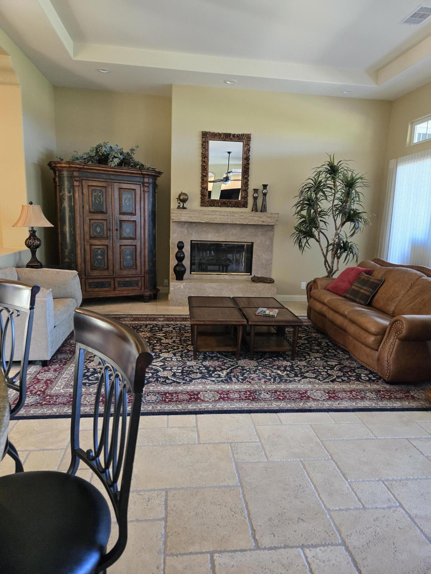 15 Vía Verde Rancho Mirage, CA 92270 - Photo 9 of 23 a living room with furniture and a fireplace