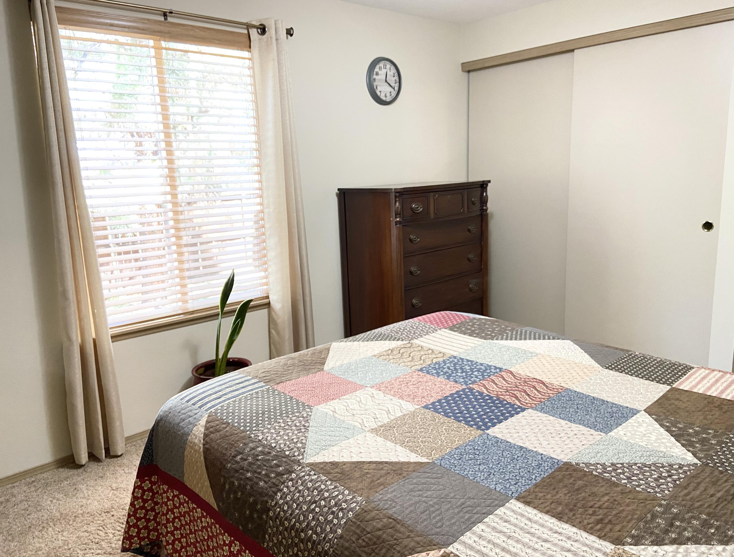 60218 Agate Road Bend, OR 97702 - Photo 13 of 19 a bedroom with a bed and a window