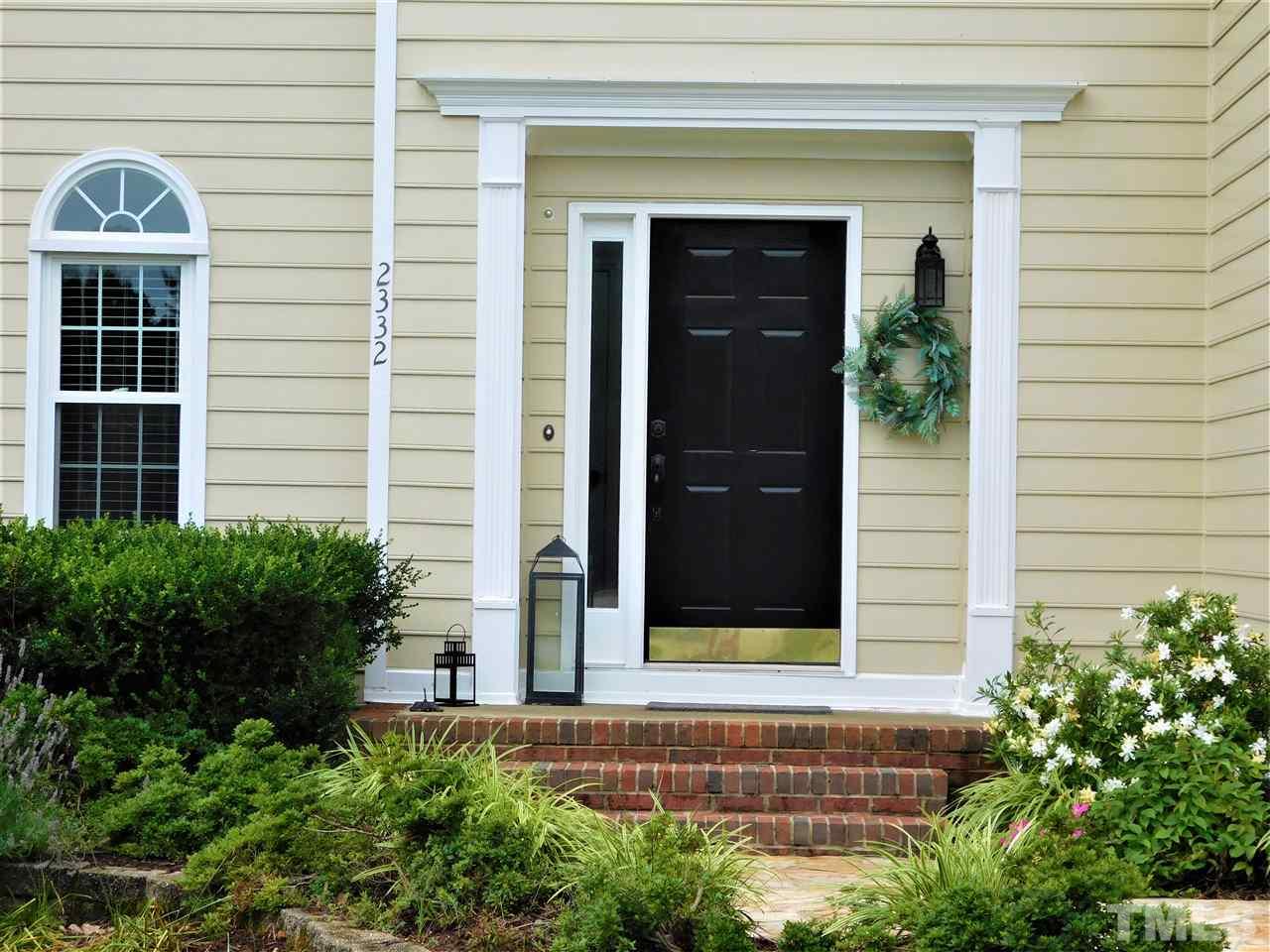 2332 Finley Ridge Lane Raleigh, NC 27615 - Photo 2 of 30 a front view of a house with a yard