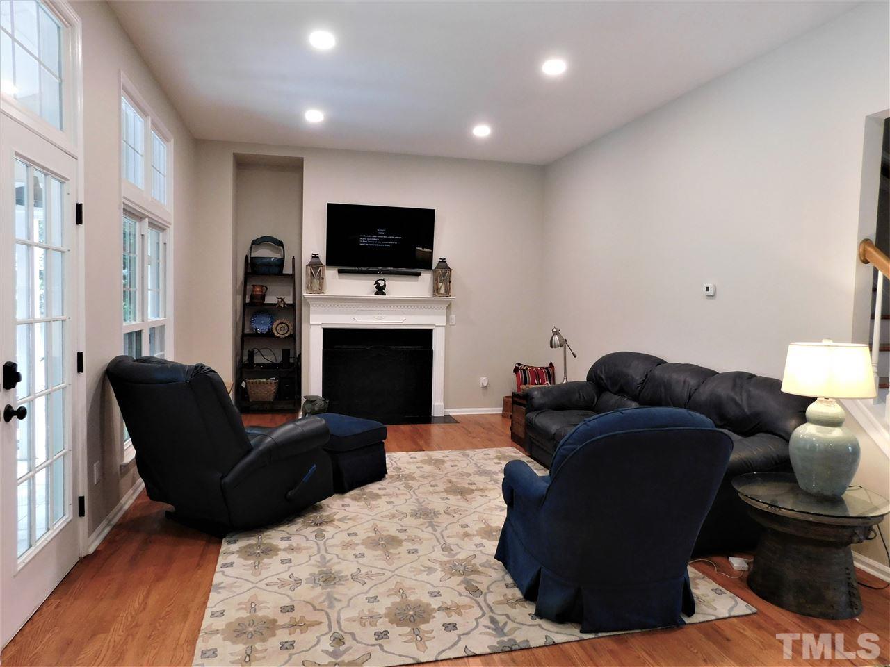 2332 Finley Ridge Lane Raleigh, NC 27615 - Photo 15 of 30 a living room with furniture and a flat screen tv