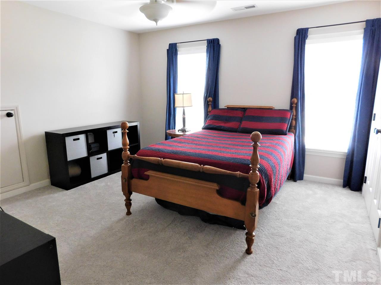 2332 Finley Ridge Lane Raleigh, NC 27615 - Photo 17 of 30 a bedroom with a bed and a window
