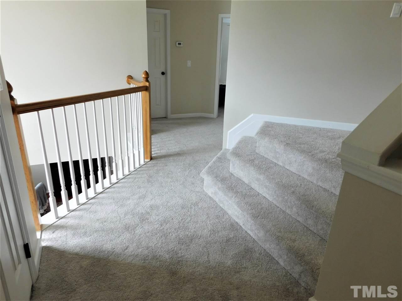 2332 Finley Ridge Lane Raleigh, NC 27615 - Photo 22 of 30 a view of a hallway with stairs