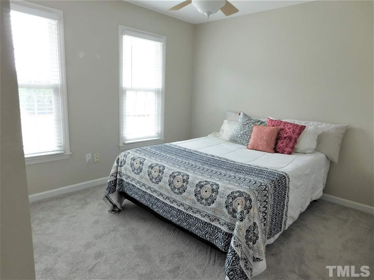 2332 Finley Ridge Lane Raleigh, NC 27615 - Photo 25 of 30 a bedroom with a bed and a window