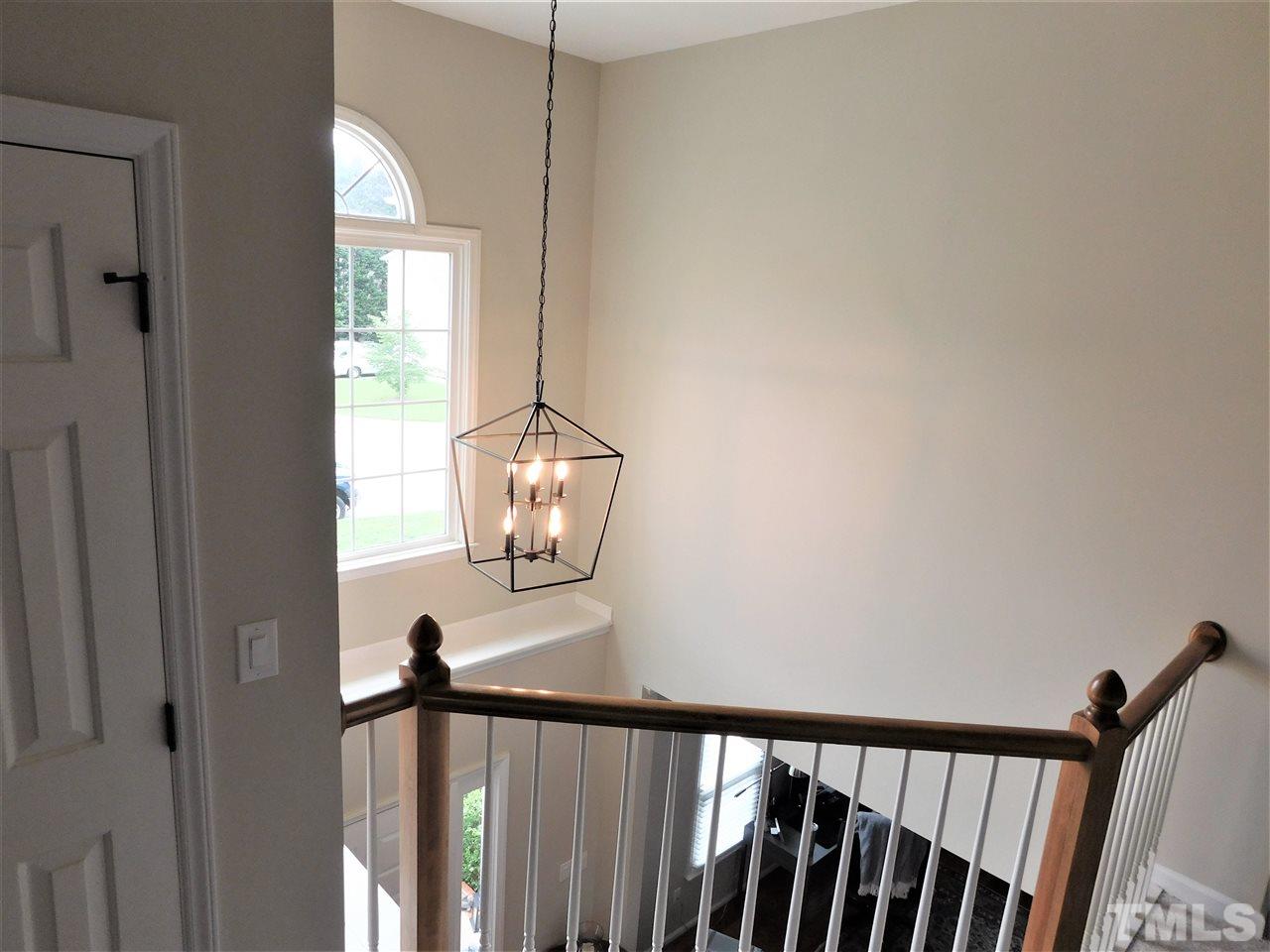 2332 Finley Ridge Lane Raleigh, NC 27615 - Photo 26 of 30 a view of a hallway with windows