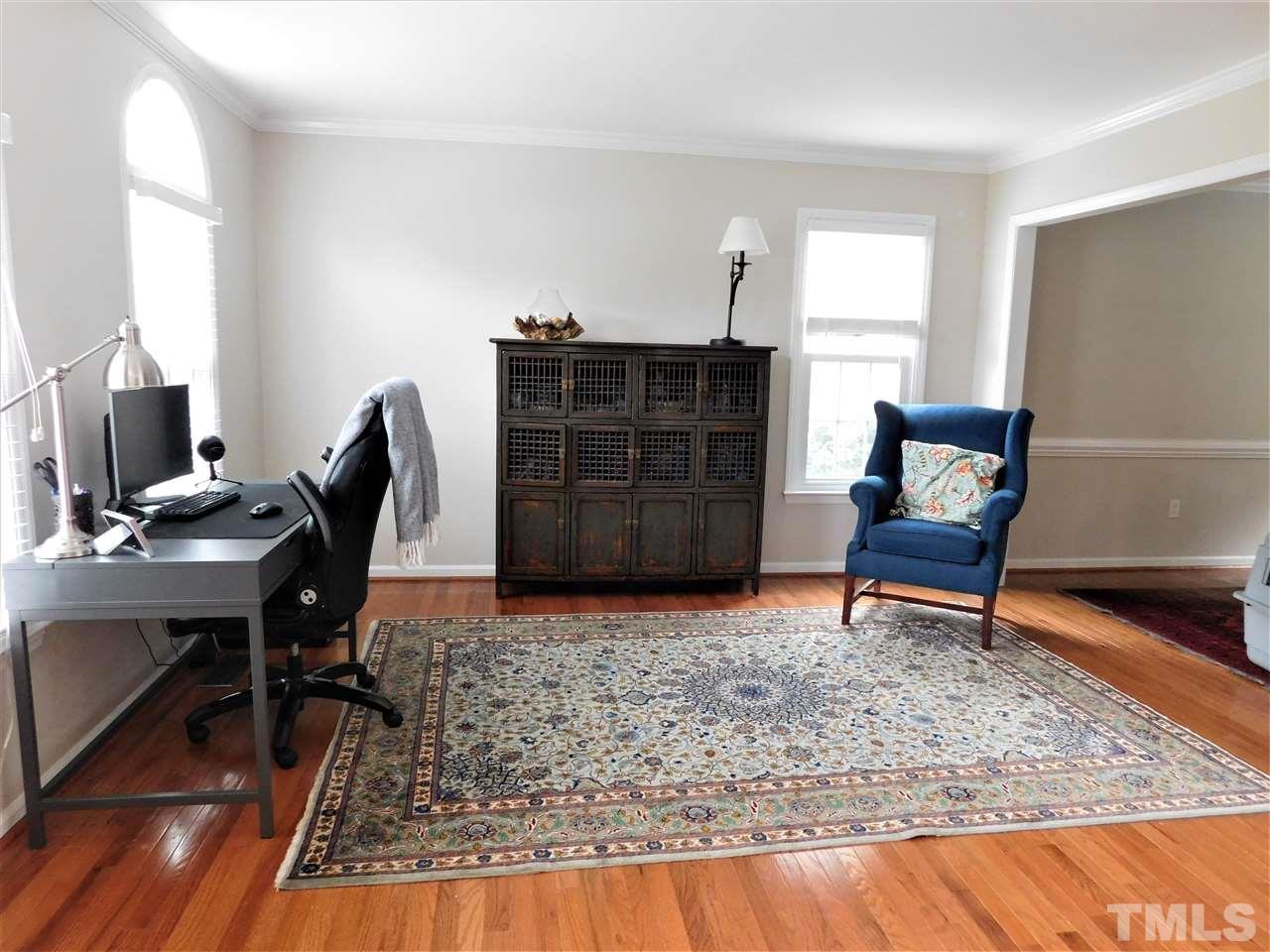 2332 Finley Ridge Lane Raleigh, NC 27615 - Photo 27 of 30 a living room with furniture and a rug