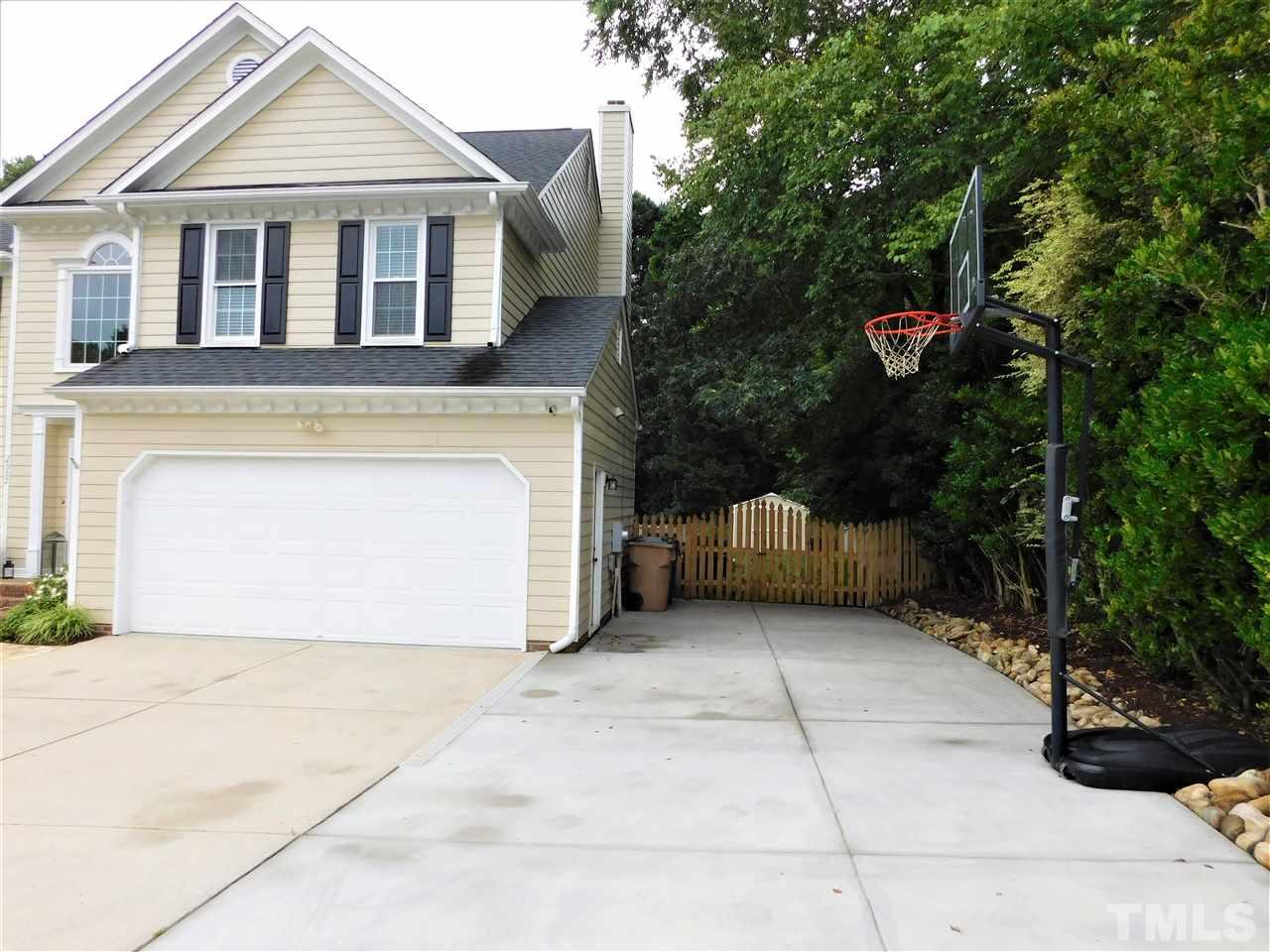 2332 Finley Ridge Lane Raleigh, NC 27615 - Photo 29 of 30 a front view of a house with a yard and garage