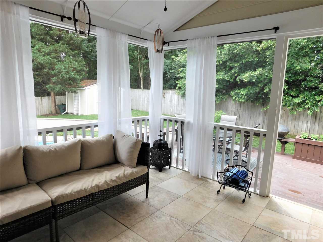 2332 Finley Ridge Lane Raleigh, NC 27615 - Photo 10 of 30 a living room with patio furniture and a large window