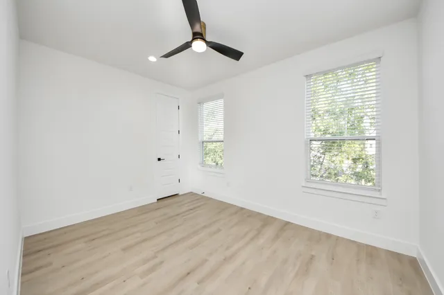 a bathroom with a bathtub shower sink vanity and toilet