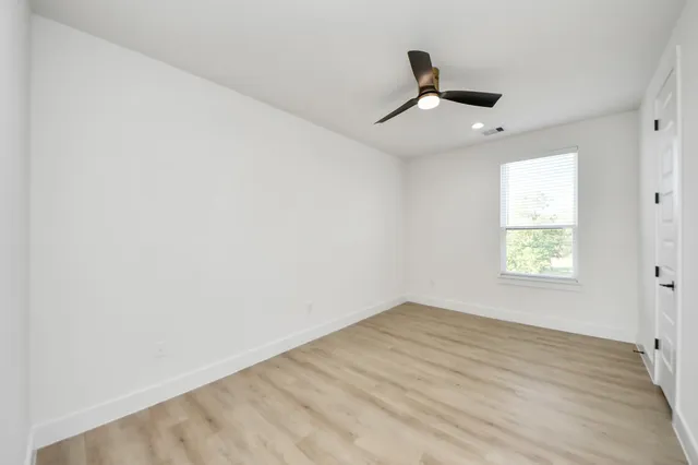 a view of balcony with wooden floor and fence