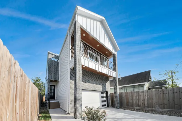 a view of a house with a door and wooden walls