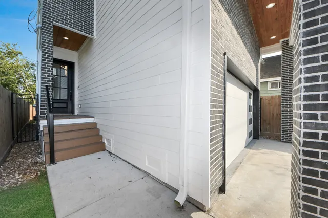 a view of a kitchen with kitchen island wooden floor center island and stainless steel appliances