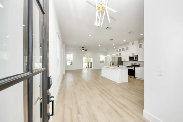a view of kitchen with cabinets and wooden floor