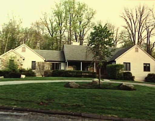 10 Mill Brook Road Stamford, CT 06902 - Photo 1 of 1 a front view of a house with a yard and trees