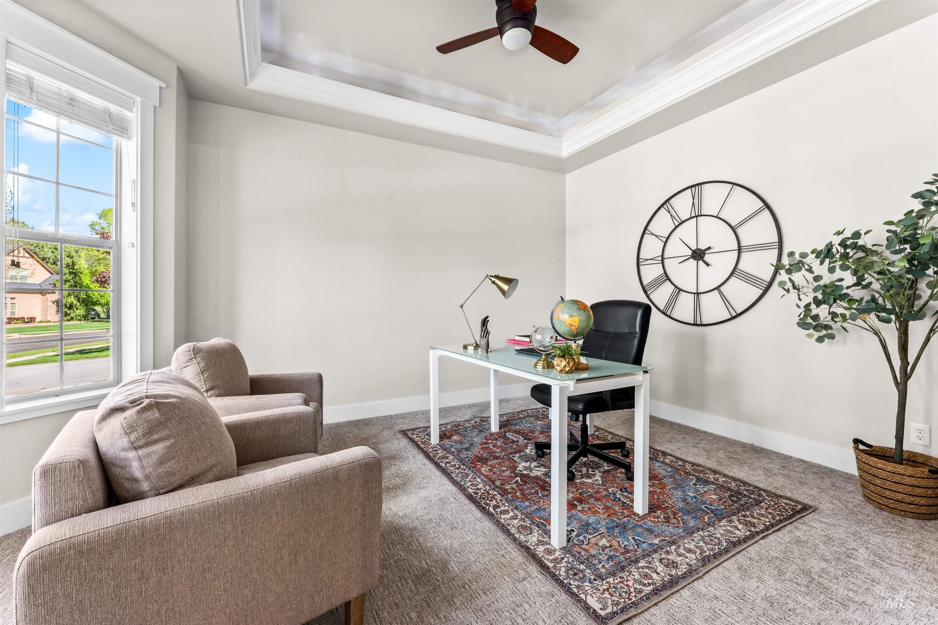 1177 East Riversong Drive Eagle, ID 83616 - Photo 15 of 36 Carpeted office featuring a ceiling fan and a tray ceiling