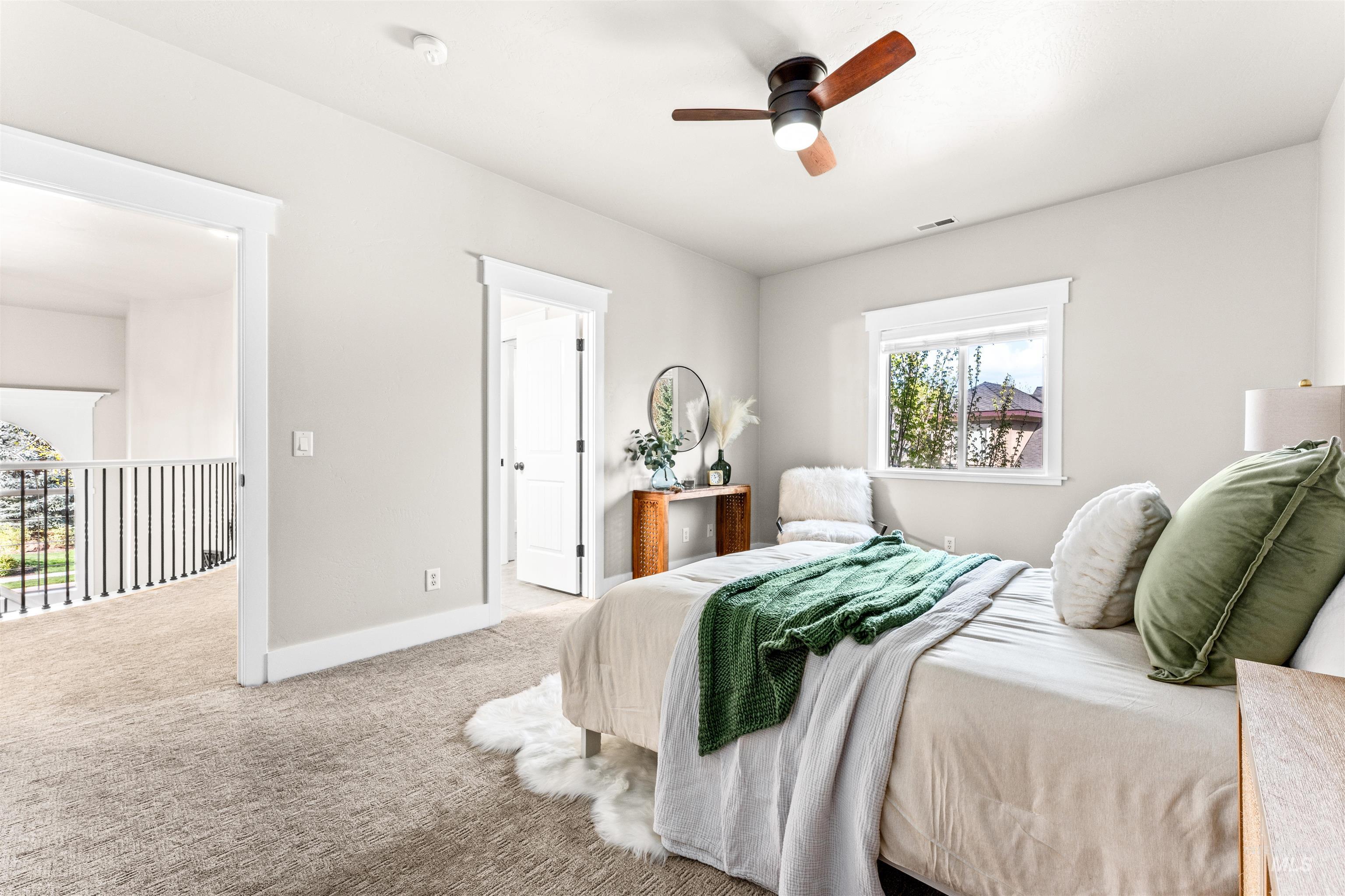 1177 East Riversong Drive Eagle, ID 83616 - Photo 20 of 36 Carpeted bedroom featuring baseboards and a ceiling fan