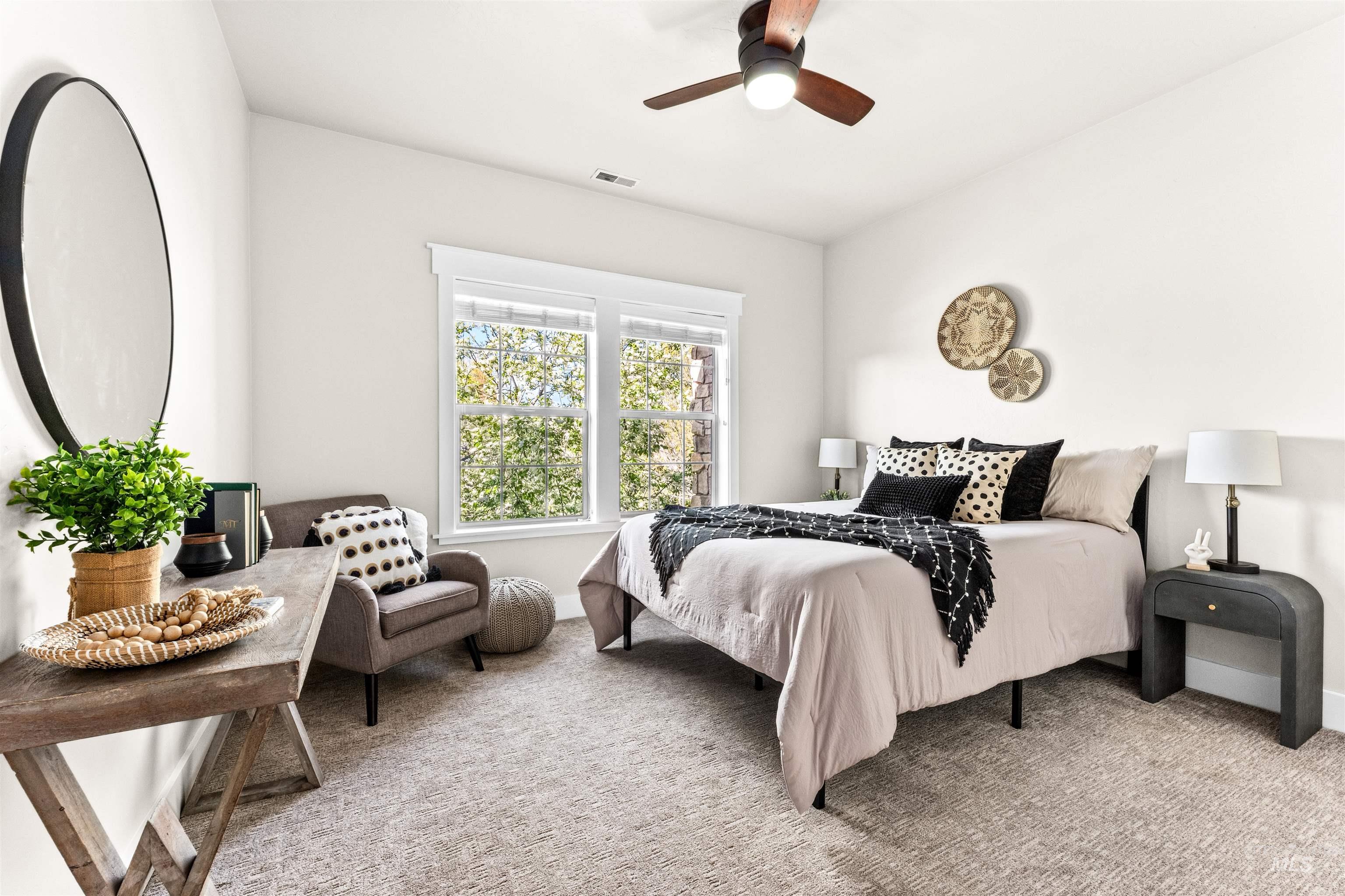 1177 East Riversong Drive Eagle, ID 83616 - Photo 21 of 36 Bedroom with light colored carpet and a ceiling fan