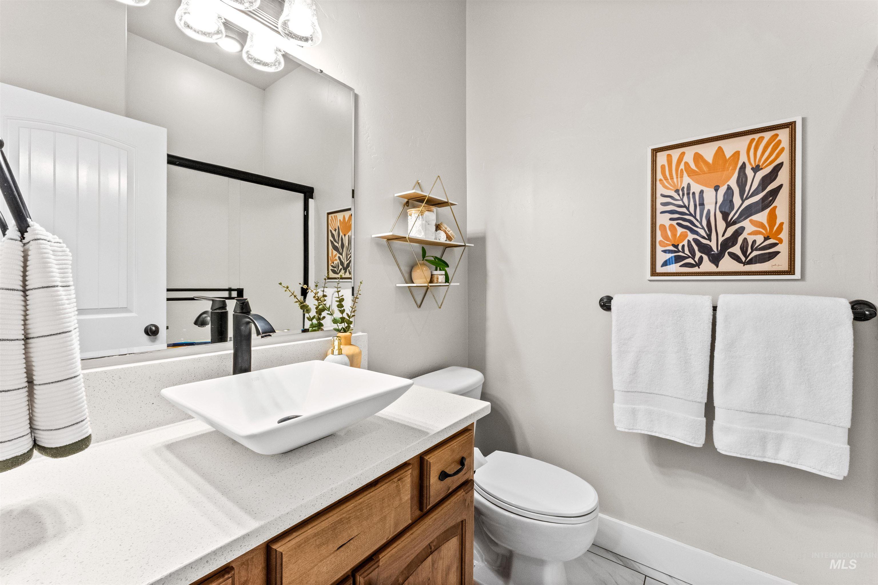 1177 East Riversong Drive Eagle, ID 83616 - Photo 25 of 36 Bathroom featuring vanity and toilet