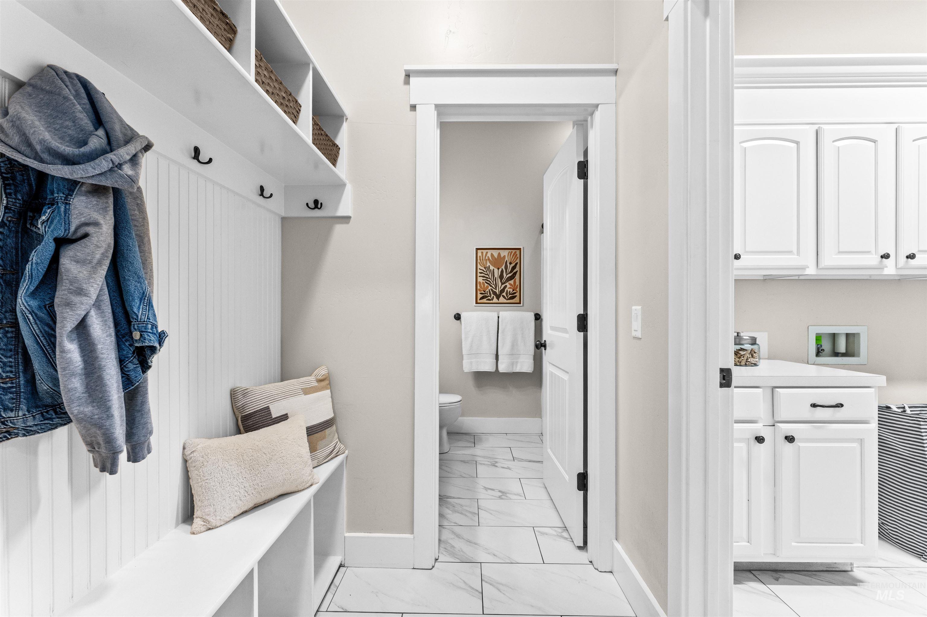 1177 East Riversong Drive Eagle, ID 83616 - Photo 27 of 36 Mudroom featuring light marble finish flooring and baseboards