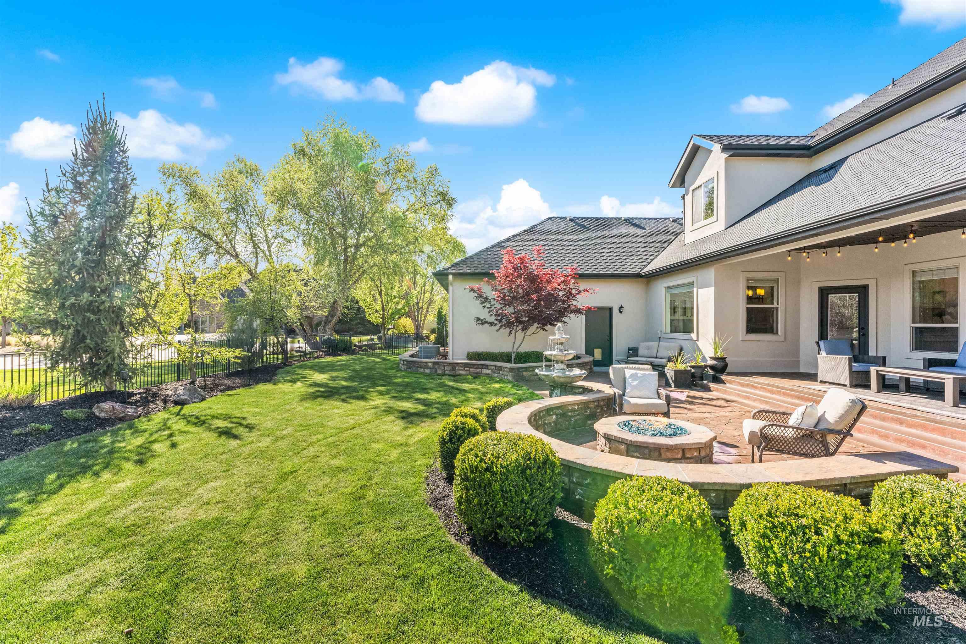 1177 East Riversong Drive Eagle, ID 83616 - Photo 31 of 36 View of yard with a patio and a fire pit