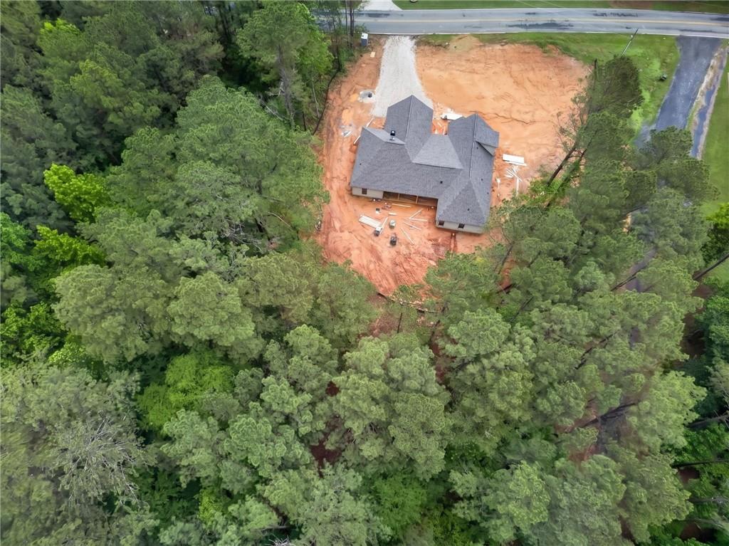 1698 Tibbitts Road Dallas, GA 30132 - Photo 10 of 16 an aerial view of a house with a yard and a large tree