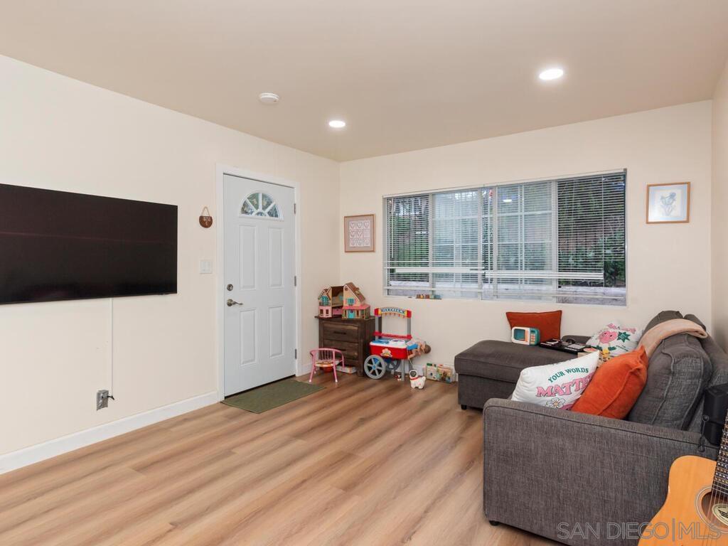 1027 Chestnut Street Escondido, CA 92025 - Photo 18 of 35 a living room with furniture and a flat screen tv