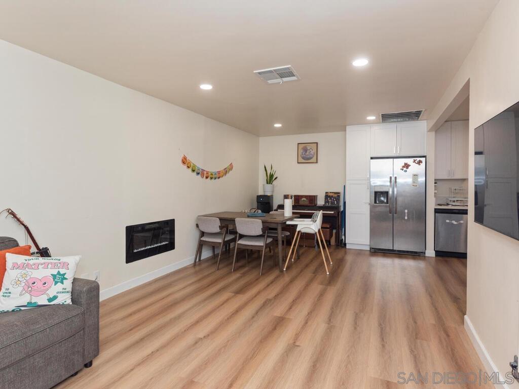 1027 Chestnut Street Escondido, CA 92025 - Photo 19 of 35 a living room with furniture and a wooden floor