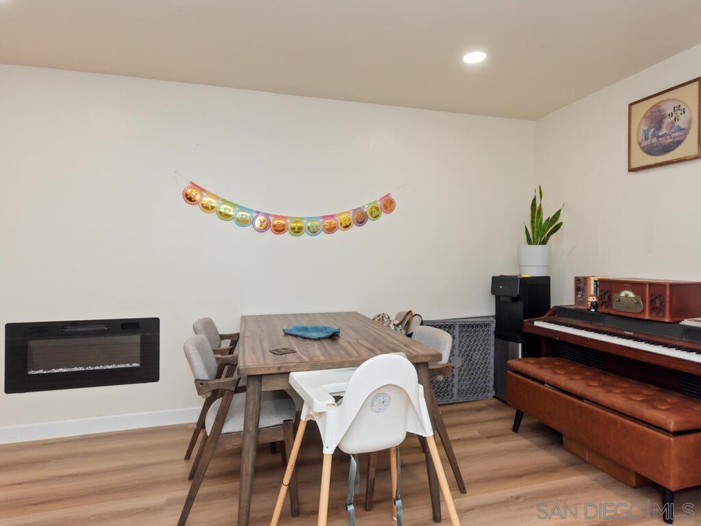 1027 Chestnut Street Escondido, CA 92025 - Photo 24 of 35 a living room with furniture and a wooden floor