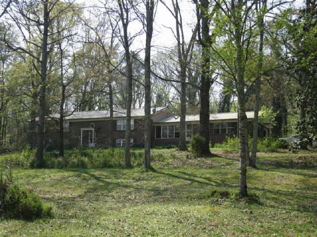 412 Brewer Road Kingston, GA 30145 - Photo 1 of 1 a view of a yard with plants and trees
