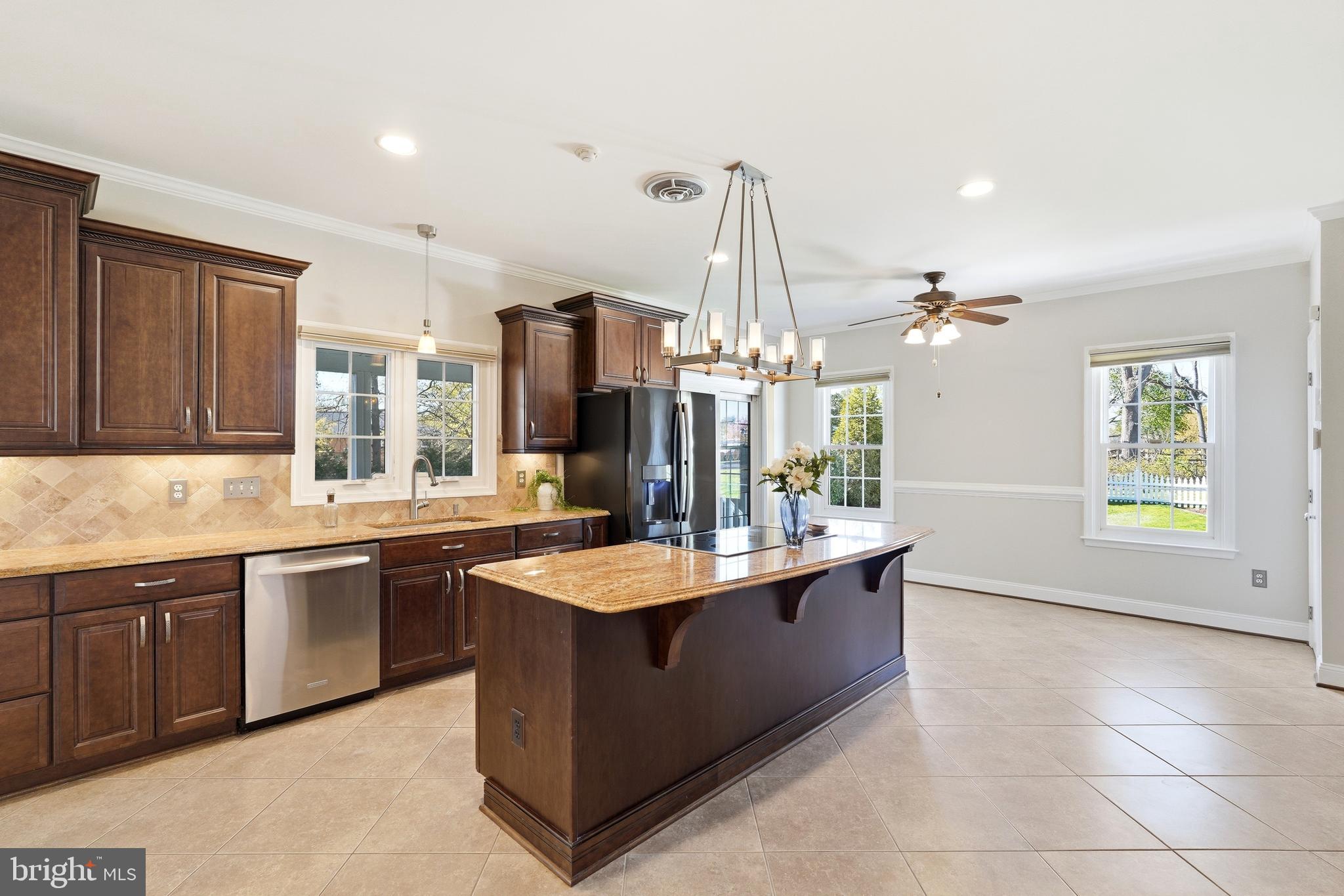 3714 Monitor Place Olney, MD 20832 - Photo 13 of 49 a large kitchen with kitchen island a sink stainless steel appliances and cabinets