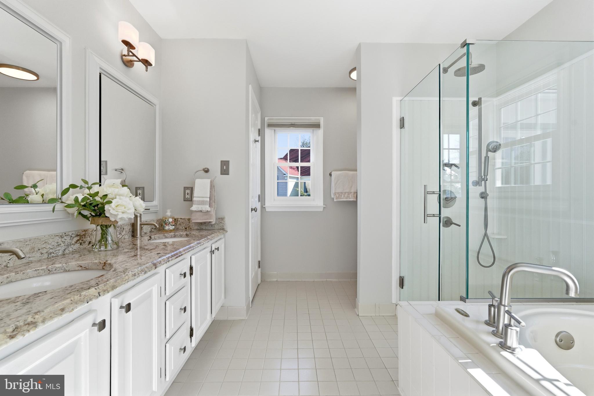 3714 Monitor Place Olney, MD 20832 - Photo 24 of 49 a bathroom with double vanity sinks a vanity a mirror and shower