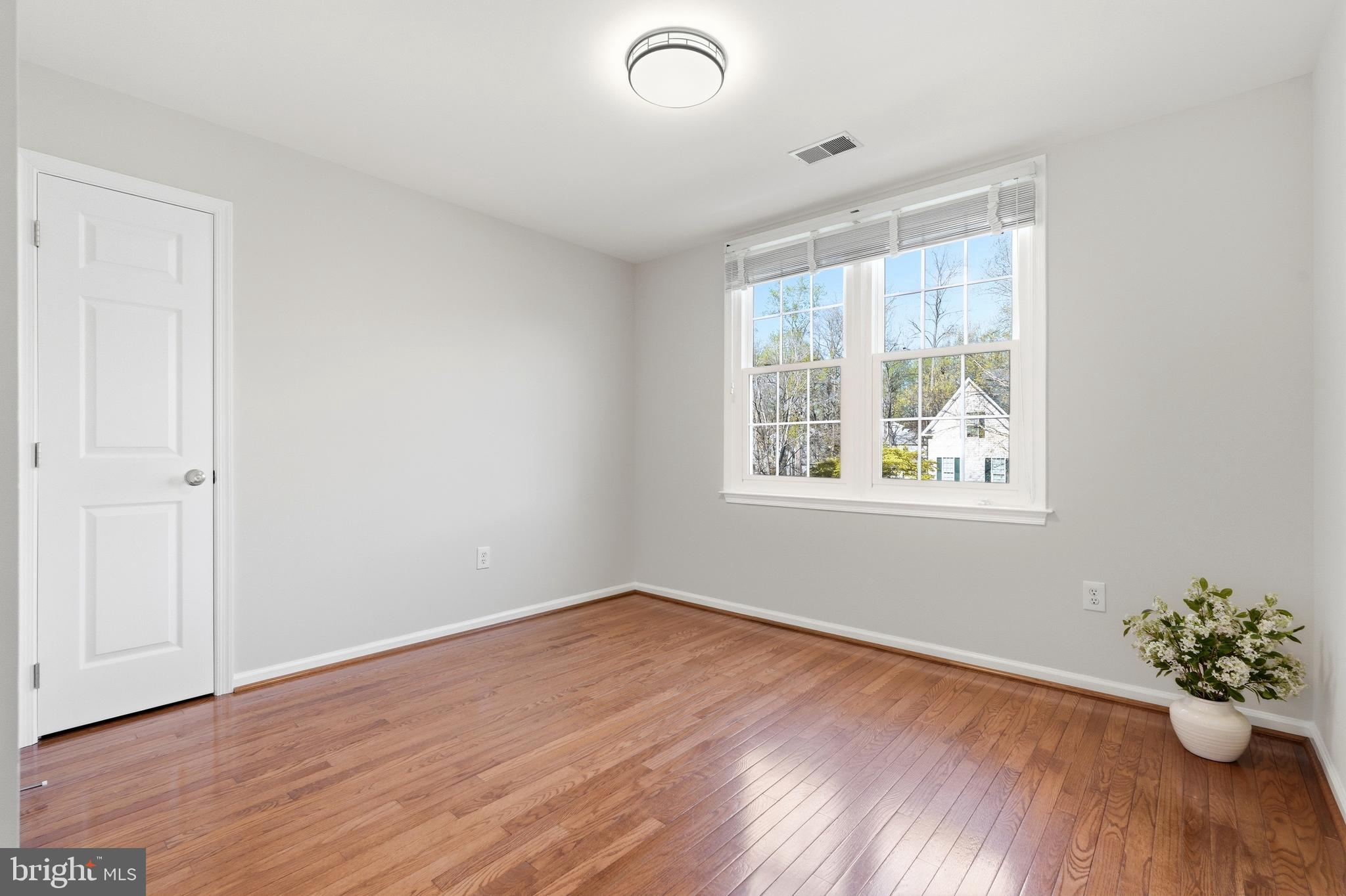 3714 Monitor Place Olney, MD 20832 - Photo 29 of 49 a view of an empty room with wooden floor and a window
