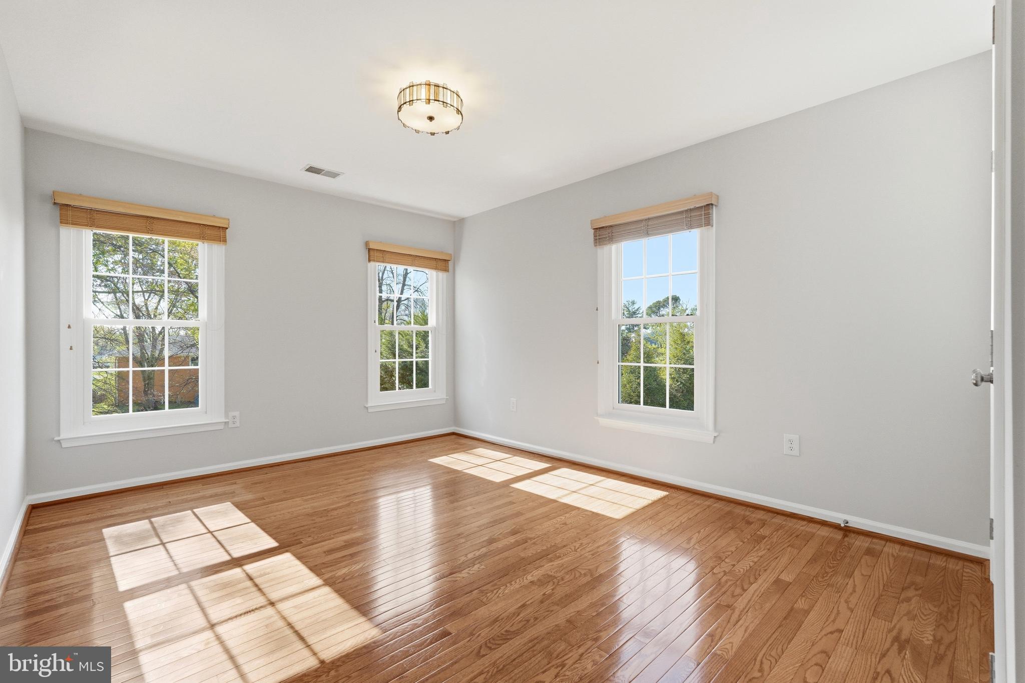 3714 Monitor Place Olney, MD 20832 - Photo 30 of 49 a view of an empty room with wooden floor and a window