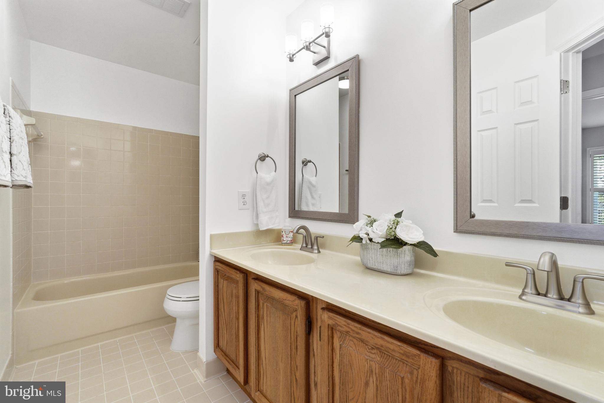 3714 Monitor Place Olney, MD 20832 - Photo 31 of 49 a bathroom with a granite countertop sink and a mirror