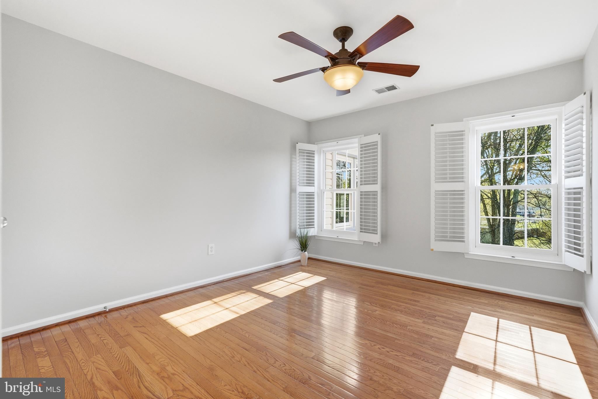 3714 Monitor Place Olney, MD 20832 - Photo 32 of 49 an empty room with wooden floor and windows