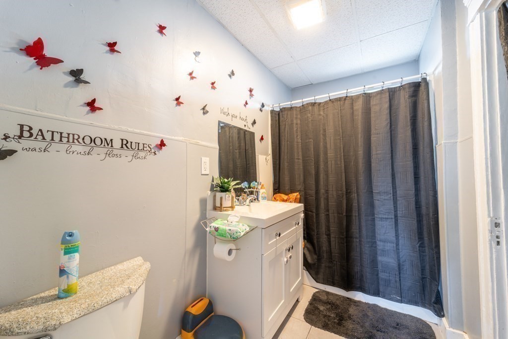 217 Beacon Street Worcester, MA 01610 - Photo 11 of 39 a room with sink dryer and washer