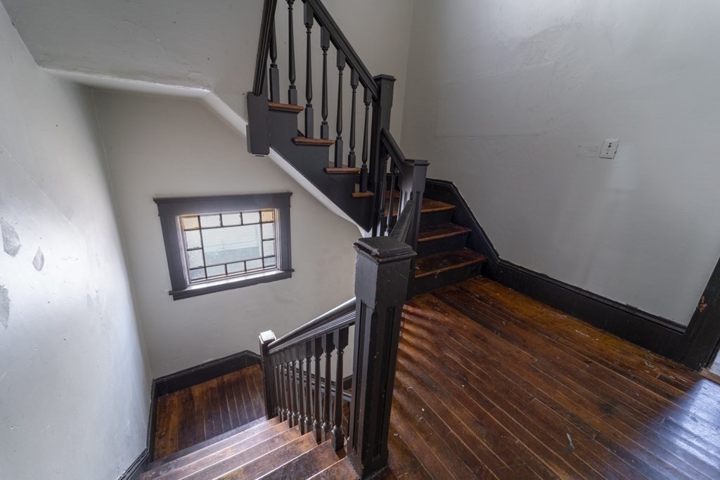 217 Beacon Street Worcester, MA 01610 - Photo 16 of 39 a view of entryway and hall with wooden floor