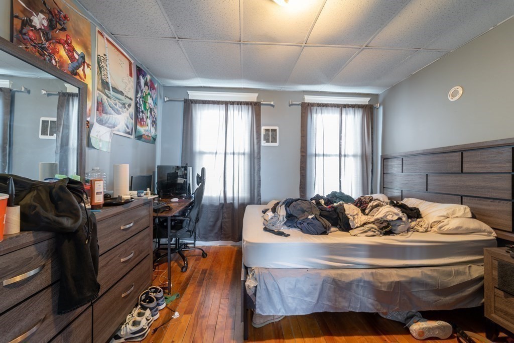 217 Beacon Street Worcester, MA 01610 - Photo 24 of 39 a bed room with furniture and a window