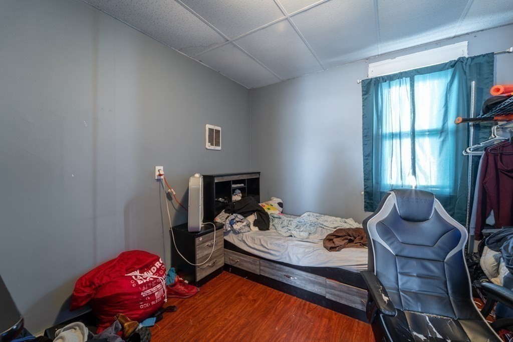 217 Beacon Street Worcester, MA 01610 - Photo 26 of 39 a bedroom with furniture and a window
