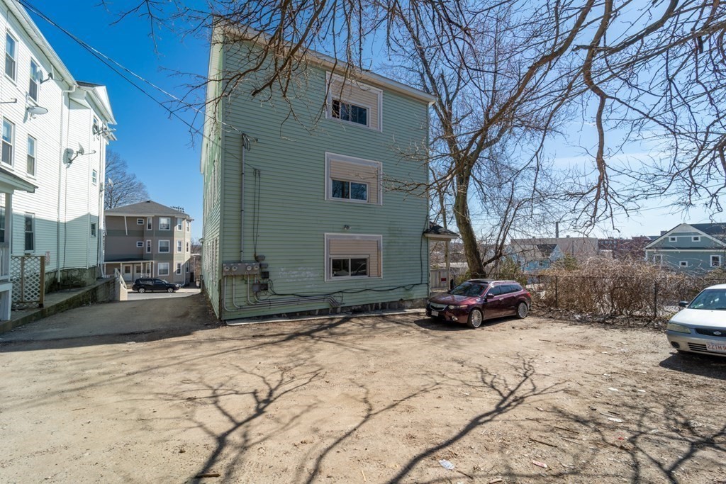 217 Beacon Street Worcester, MA 01610 - Photo 3 of 39 a view of a backyard of a house