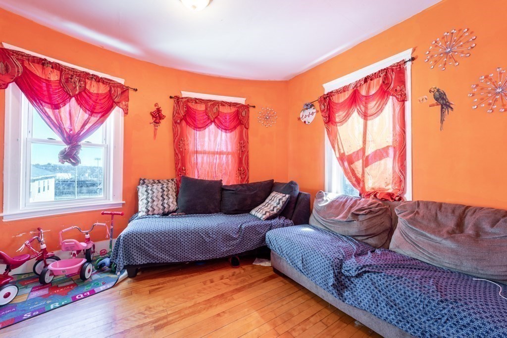 217 Beacon Street Worcester, MA 01610 - Photo 32 of 39 a living room with furniture and a large window