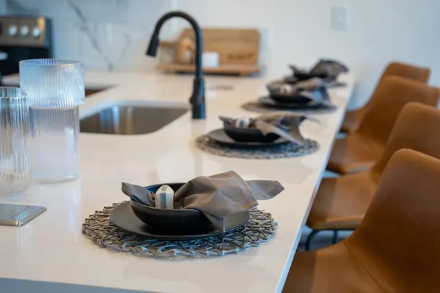 a kitchen with a sink and a stove