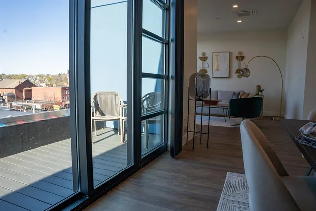 a kitchen with granite countertop a refrigerator and a stove