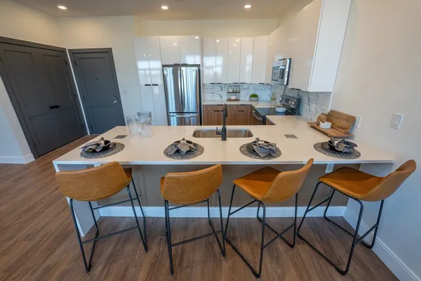 a view of a dining room with furniture and wooden floor