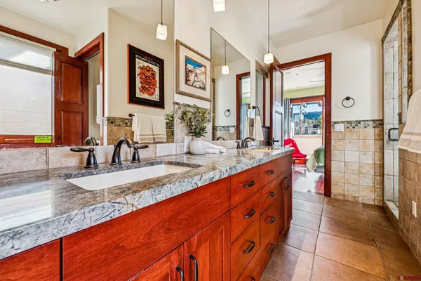 a bathroom with a bathtub and a shower